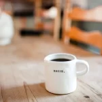 coffee mug with the word beginning written on it