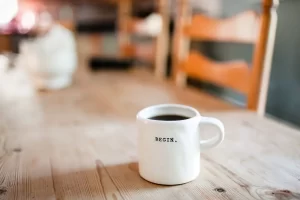 coffee mug with the word beginning written on it